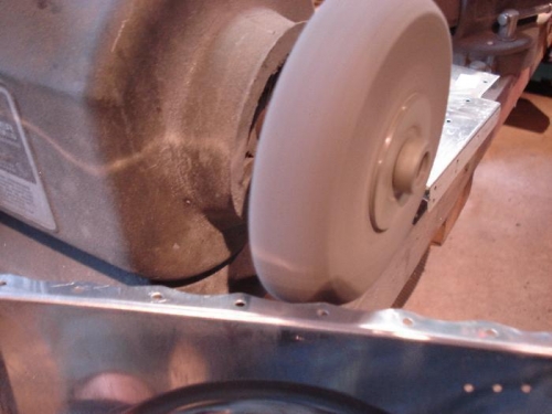 Deburring scalloped flange.