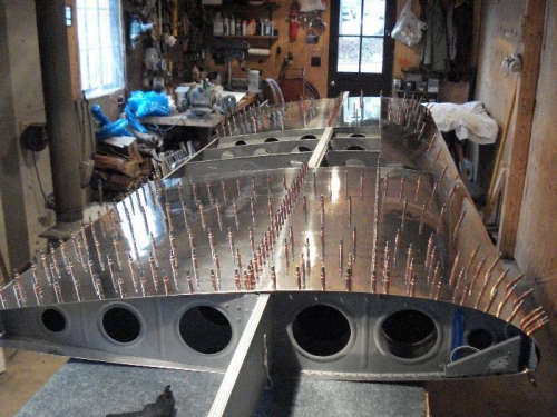 Working on the top of the wing.