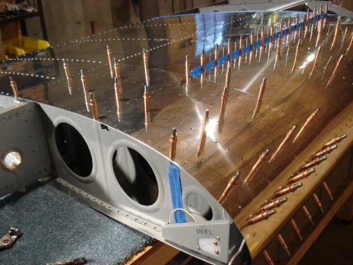Inboard skin riveted.