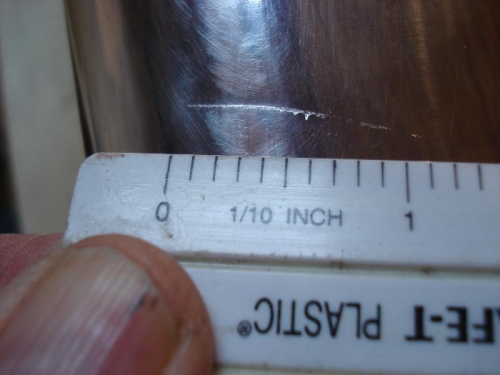 Scratch, right wing leading edge.