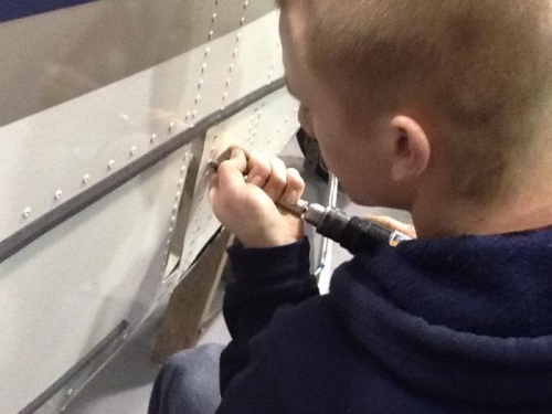 Drilling rivets.