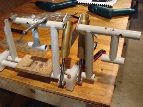 Brake pedals clamped for drilling.