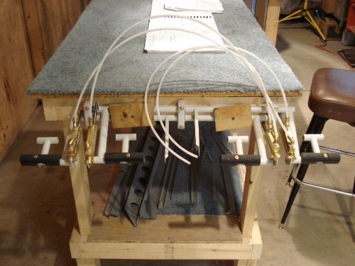 Rudder assembly mounted to end of workbench.