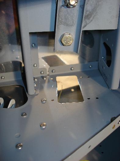 Hole cut in seat rib.