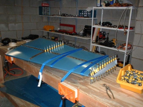 Left side strapped to table, HS-707 riveted in place