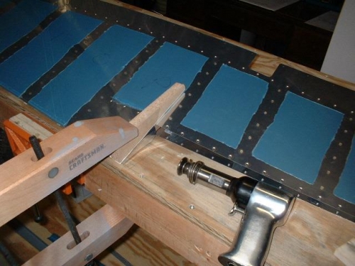 Bending the top tab to allow room for the trim tab