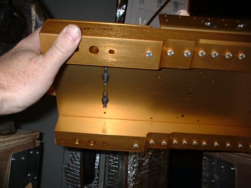 Two nutplates in each spar web riveted in place