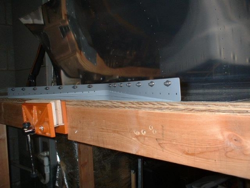 Nutplates riveted to the leading edge/fuel tank coupler plate