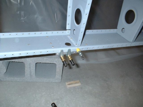 Countersink rear spar where the reinforcement plates are located