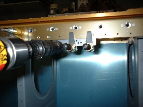 Countersinking the bottom of the spar using a guide for the pilot