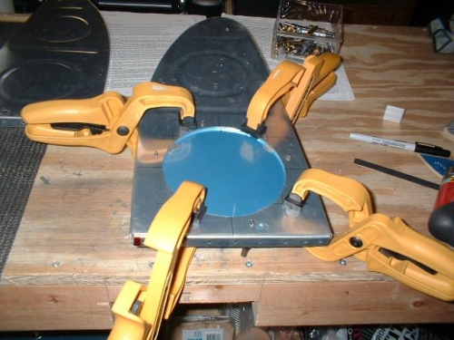 Access ring and plate clamped to rib - ready for drilling