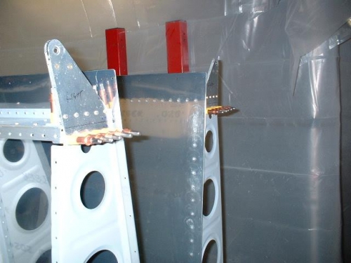 Drill outboard aileron brackets to ribs and rear spar
