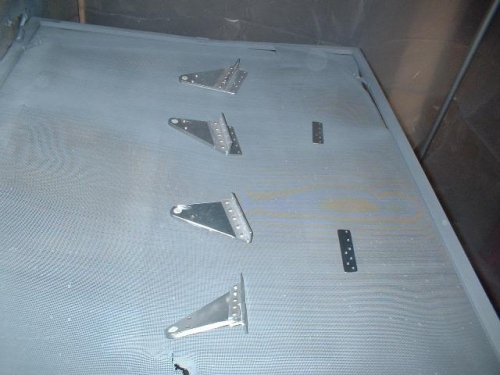 Aileron brackets ready to be primed; bearings taped