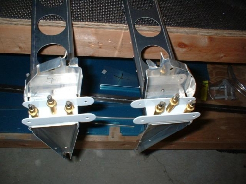 Inboard brackets drilled to ribs and spars