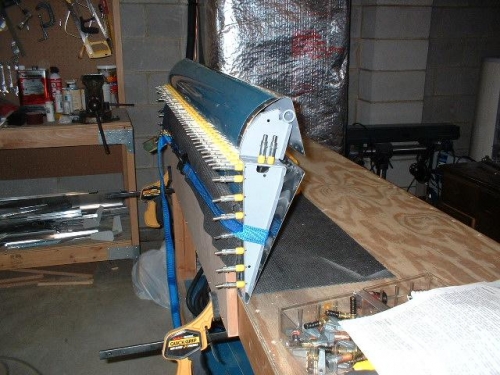Left aileron clecoed and clamped to bench - ready to rivet