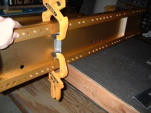Clamp stiffeners to web