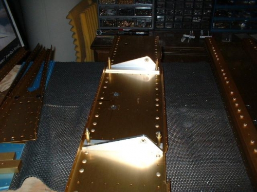 Control column brackets drilled to spar