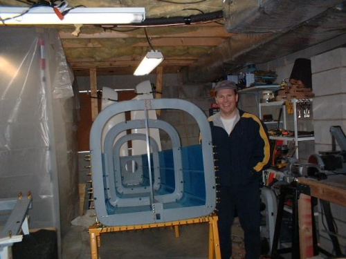 Crooked picture of me in my basement next to the aft fuselage