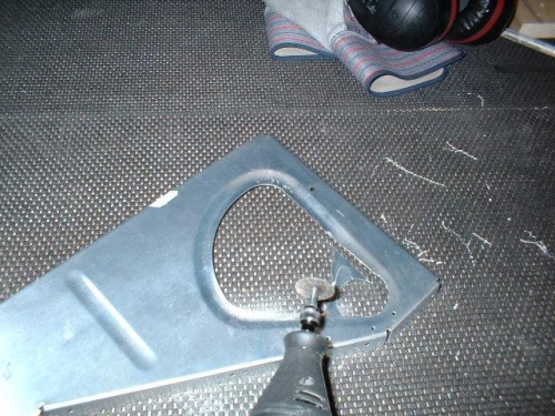 The dremel tool with a cutoff wheel to remove material