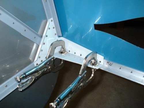Inside view of side skin and longeron drilled to steel brackets
