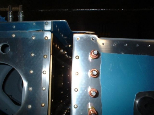 Drill out bottom forward rivet around spar cutout for bottom ski
