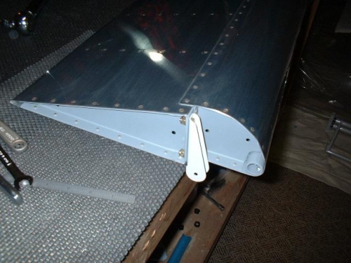 Outboard bracket bolted to right aileron