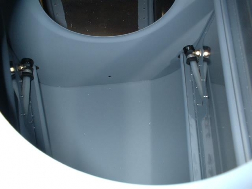 Adel clamps installed around plastic rudder cable slip tubes