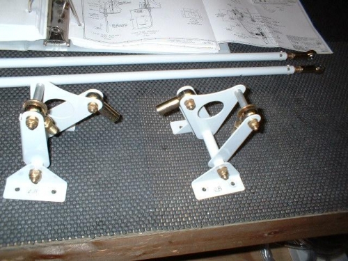 Rod end bearings bolted to aileron bellcranks