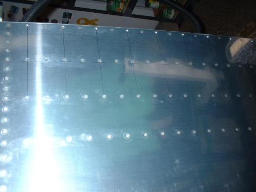 Bottom skin holes marked for later match-drilling to fuselage