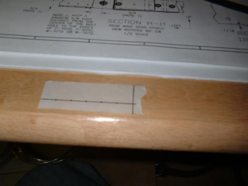 Masking tape with evenly spaced marks for rivets