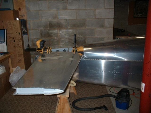 Horizontal stabilizer positioned and clamped to aft deck