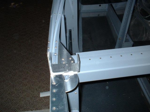 Outboard face of right attach angles tapered to fuselage contour