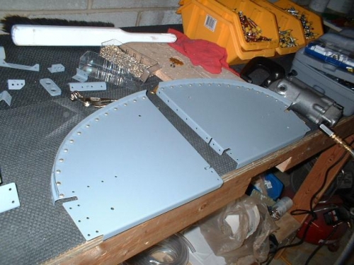 Seal angles riveted to outboard subpanels