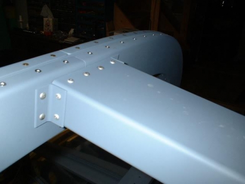Top channel riveted to rollbar
