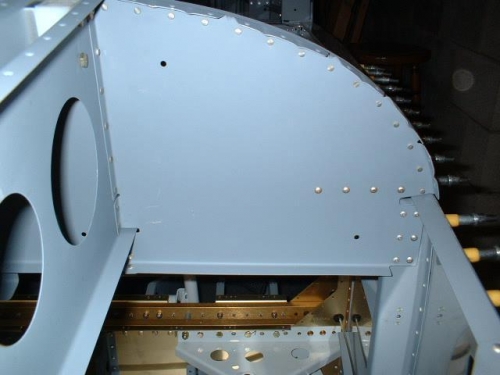 Left sub panel riveted to bulkhead, deck, and center section
