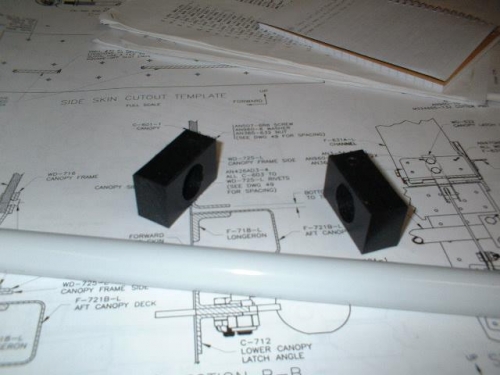 Top holes drilled in C-611 canopy latch bushing blocks