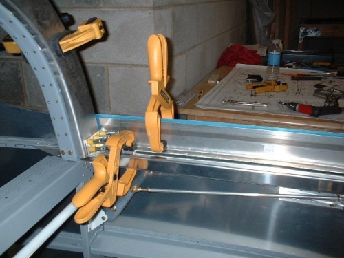 F631 channels clamped to rollbar and aft end ofleft side rail clamped in position