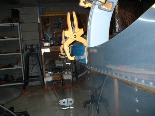 Exterior picture of left side rail and skirt clamped to frame