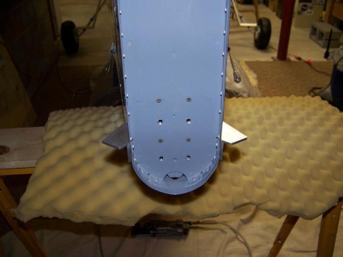 Rudder stops riveted to fuselage