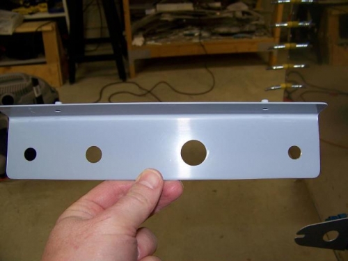 Panel bracket for engine control cables drilled and deburred