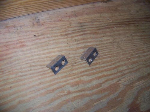 Two short pieces of angle drilled for headset jacks