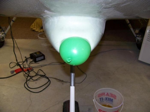 One layer of fiberglass held in place against the foam mold with a ballon
