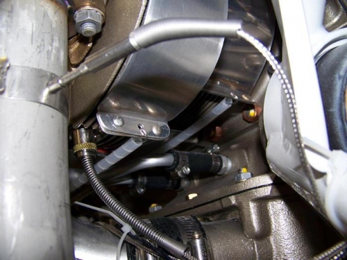 Left baffle cylinder fin wraps saftey wired and protected with spiral conduit - aft view