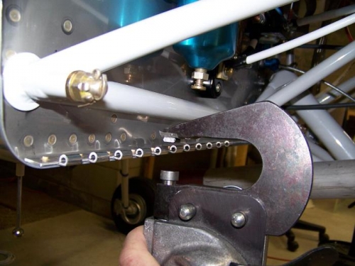 Tapered no-hole yoke with small steel spacer taped to it to clear hinge eyelets