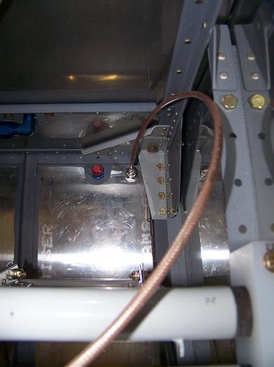 RG400 antenna cable attached to transponder located on front right corner of fuselage floor