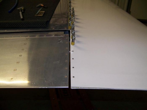 Fiberglass tip clecoed to wing and rib clecoed to tip - aft rivets set with hand squeezer