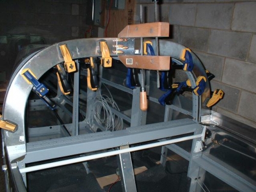 Splice plate and drill jig clamped to F-631A channels