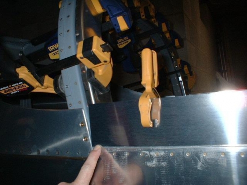 Right side skirt used to properly position side rail for a flush assembly