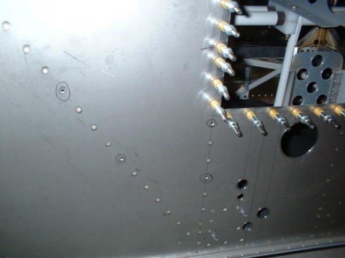 Drill out circled rivets for battery tray and relay mounting