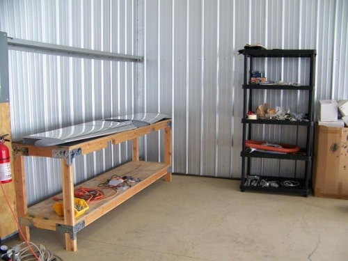 Large workbench and shelf move to hangar